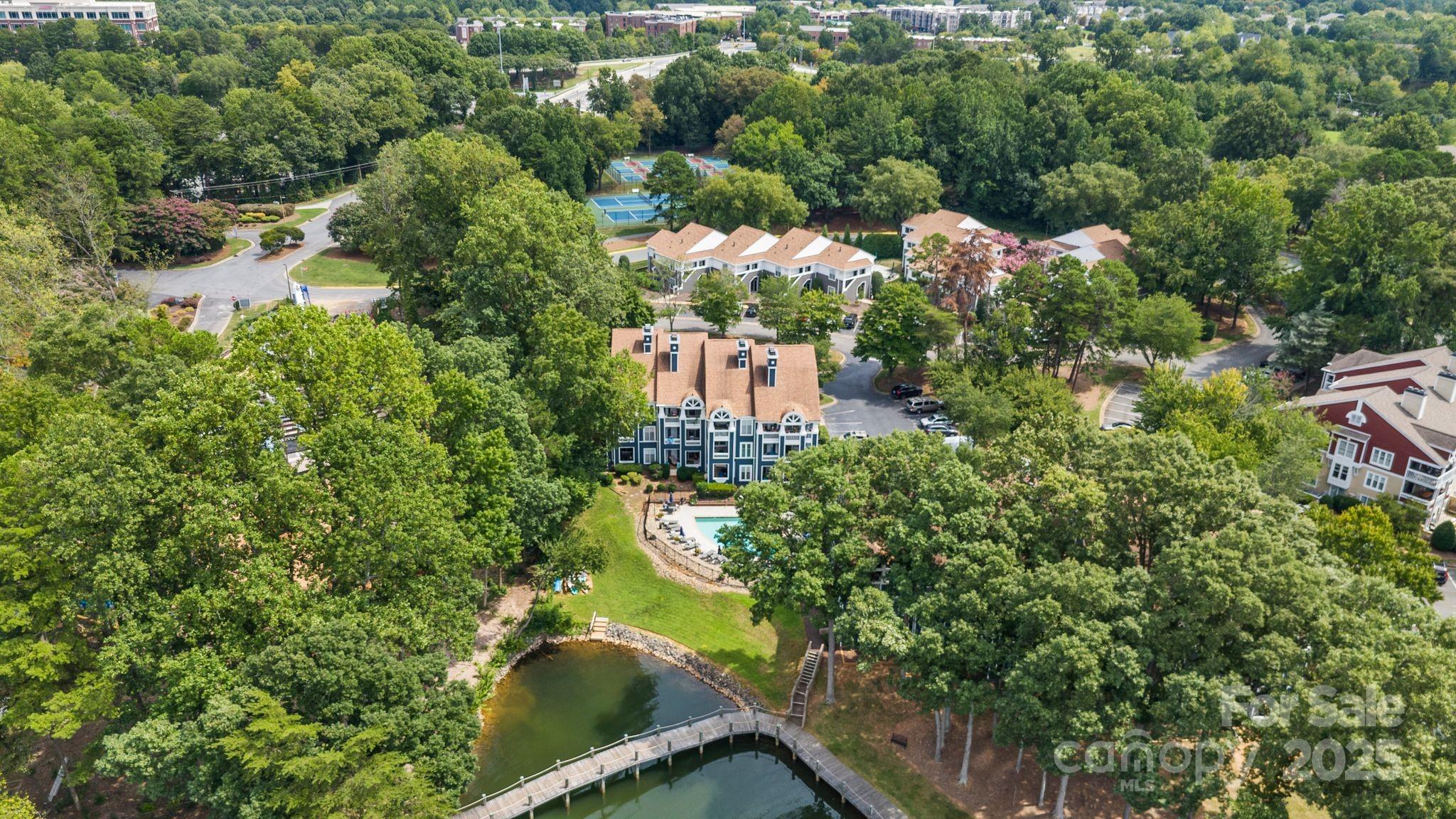 719 Southwest Drive Davidson, NC 28036 - Photo 22 of 27 a view of a lake with a house