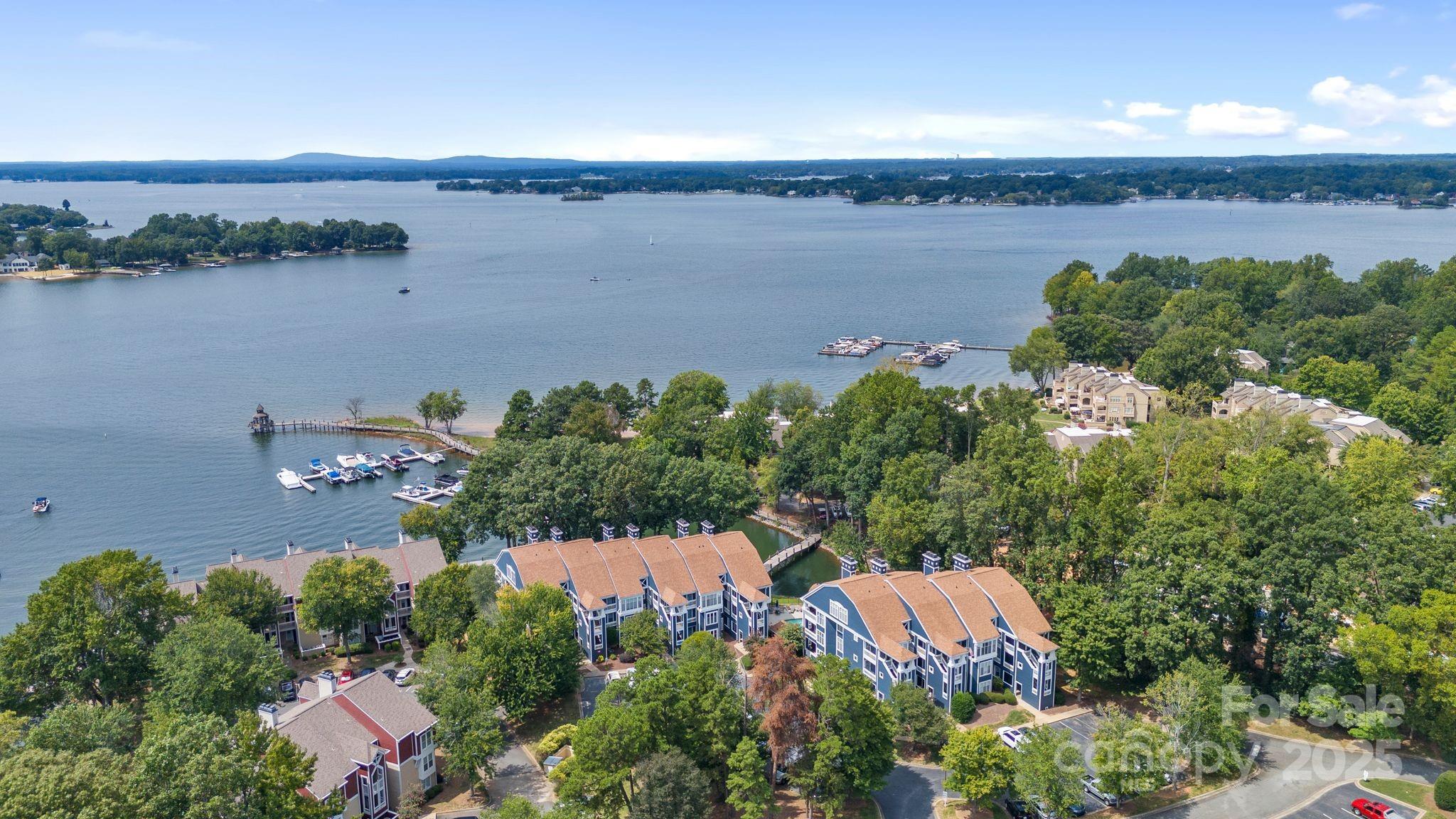 719 Southwest Drive Davidson, NC 28036 - Photo 23 of 27 an aerial view of a houses with a lake view