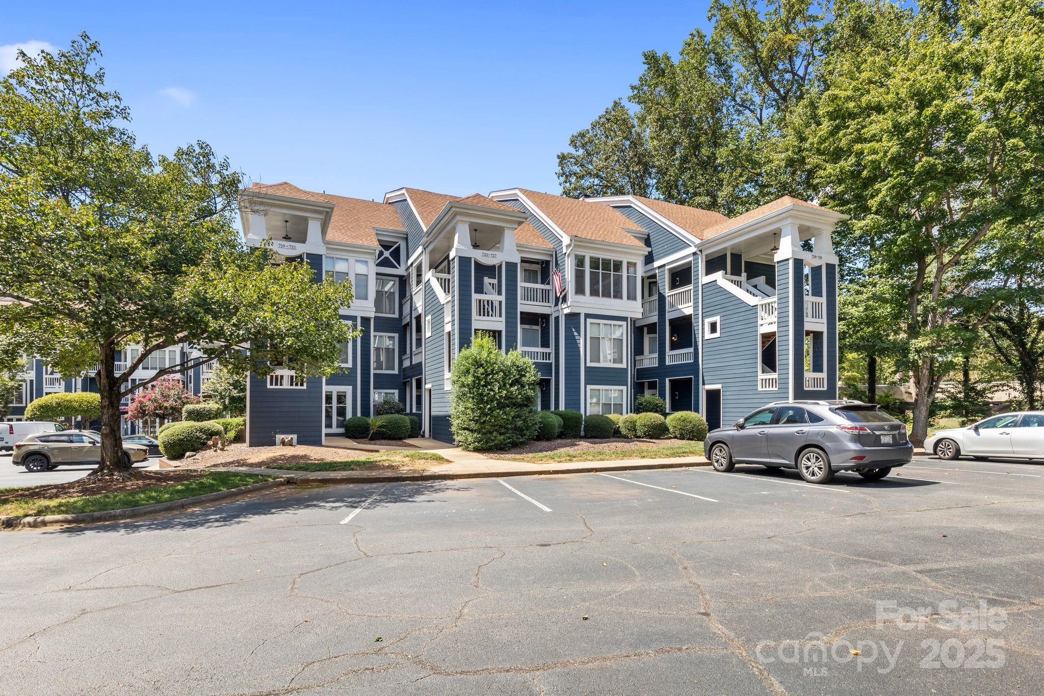 719 Southwest Drive Davidson, NC 28036 - Photo 26 of 27 a parked cars parked in front of a building