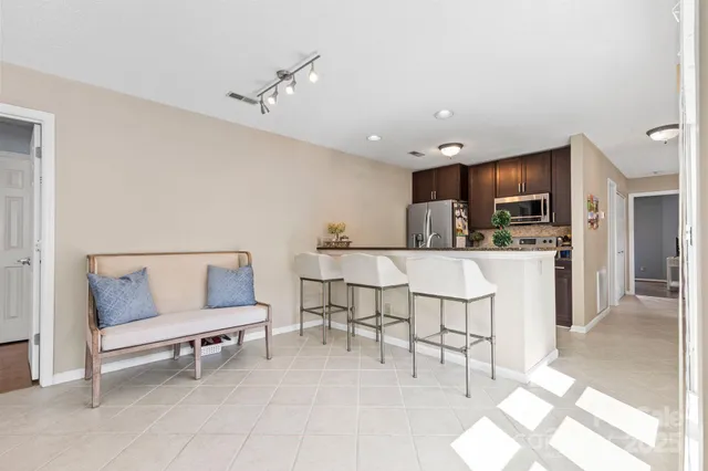 a kitchen with stainless steel appliances granite countertop a stove and a microwave