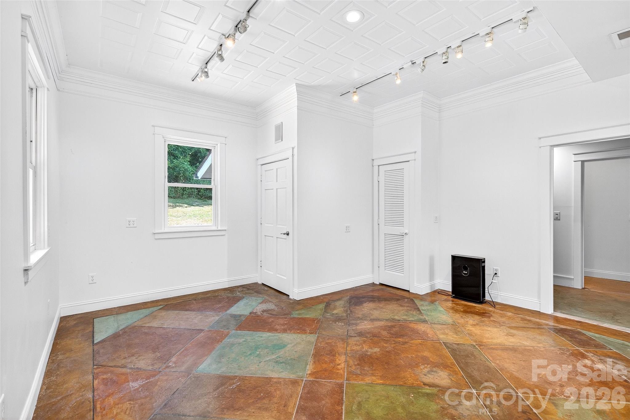 626 Old Lytle Cove Road Swannanoa, NC 28778 - Photo 11 of 48 a view of a livingroom with a chandelier fan and windows