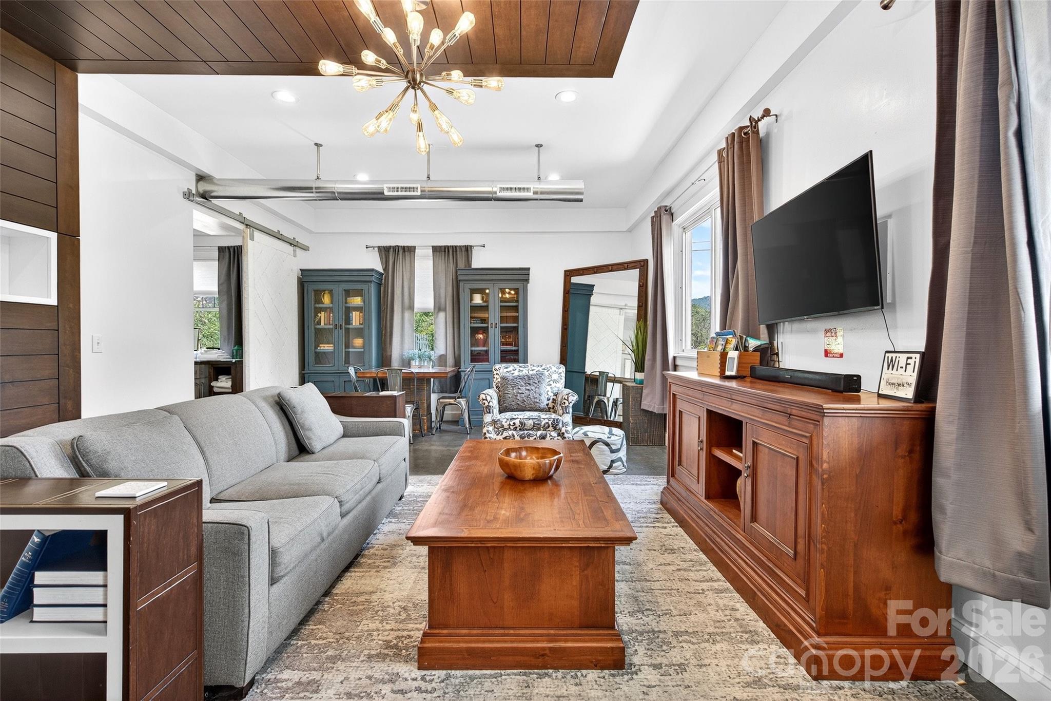 626 Old Lytle Cove Road Swannanoa, NC 28778 - Photo 14 of 48 a living room with furniture and a flat screen tv