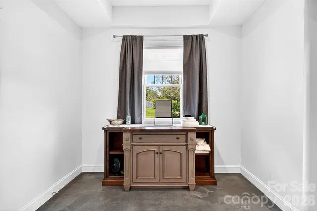 a view of a kitchen with a sink and a window