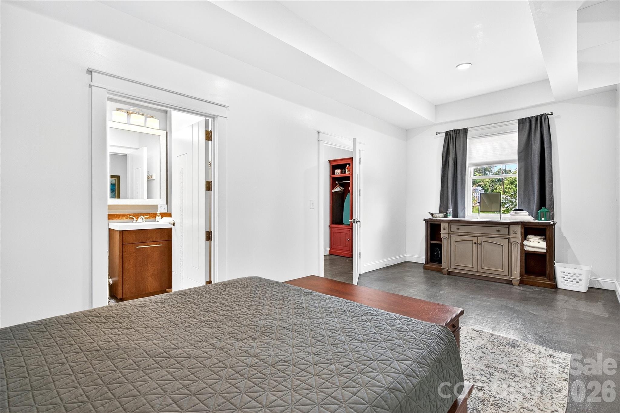 626 Old Lytle Cove Road Swannanoa, NC 28778 - Photo 22 of 48 a bedroom with a bed and a view of kitchen