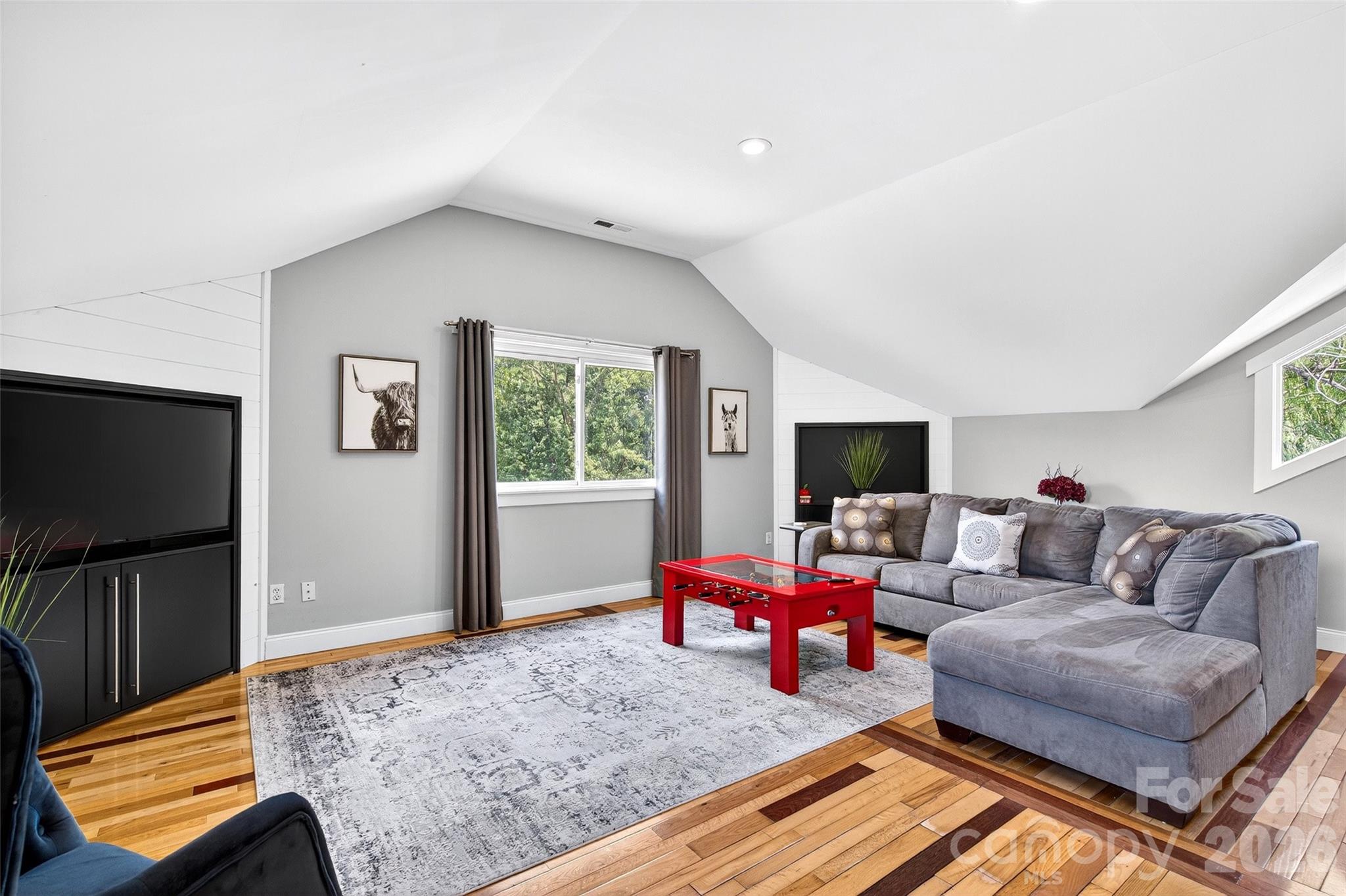 626 Old Lytle Cove Road Swannanoa, NC 28778 - Photo 32 of 48 a living room with furniture and a flat screen tv