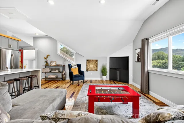 a kitchen with stainless steel appliances a sink stove top oven and cabinets