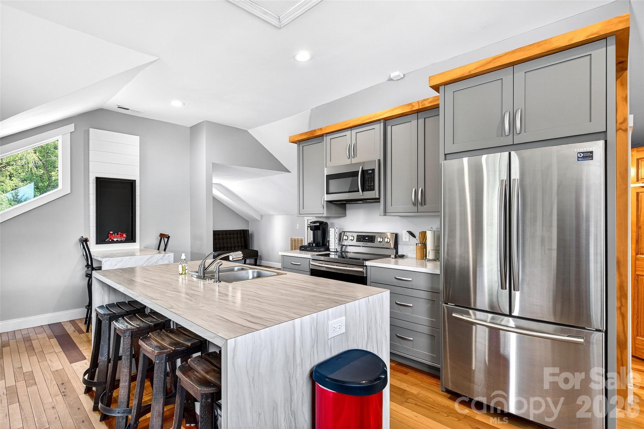 626 Old Lytle Cove Road Swannanoa, NC 28778 - Photo 37 of 48 a kitchen with kitchen island a refrigerator stove and microwave