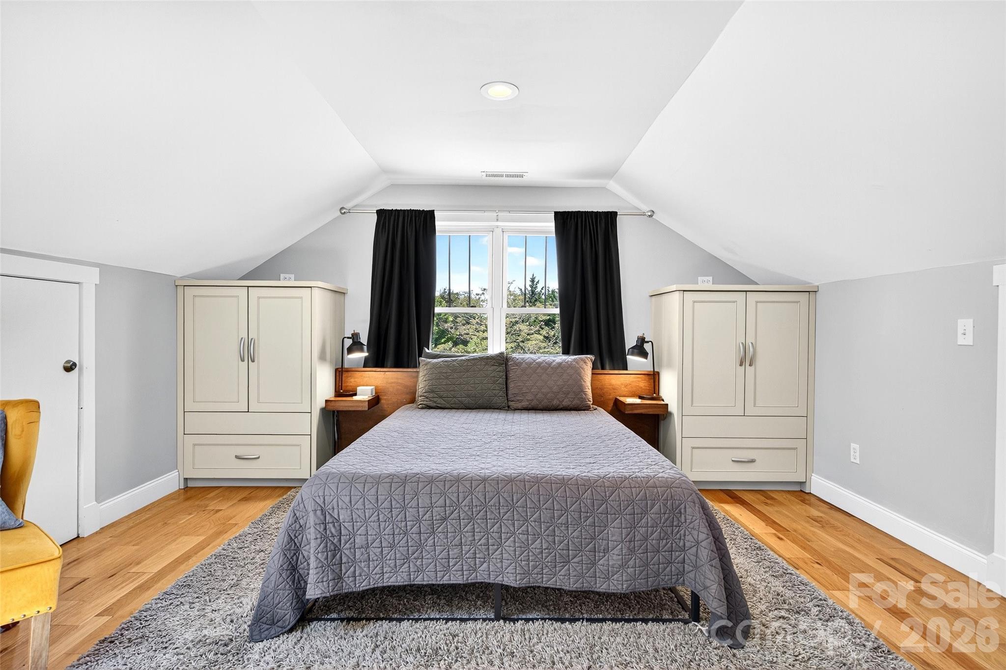 626 Old Lytle Cove Road Swannanoa, NC 28778 - Photo 40 of 48 a bedroom with a large bed and a window