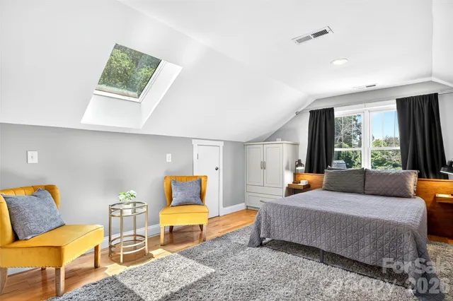 a bedroom with bed and window