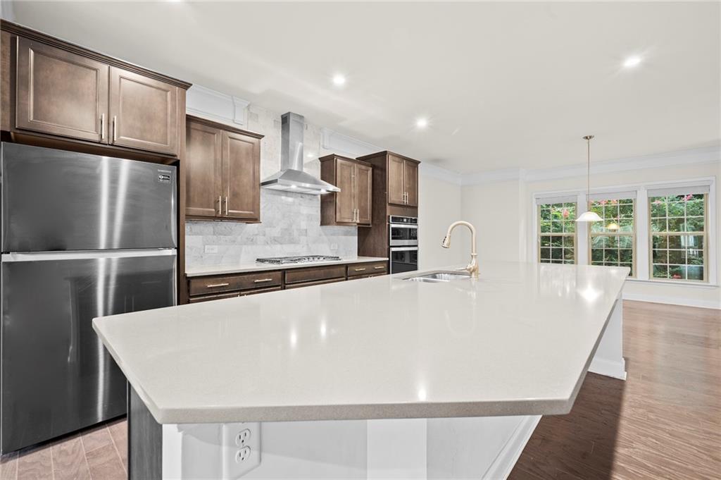 2166 Rock Creek Park Decatur, GA 30033 - Photo 11 of 40 a large white kitchen with a refrigerator a sink and a counter top space