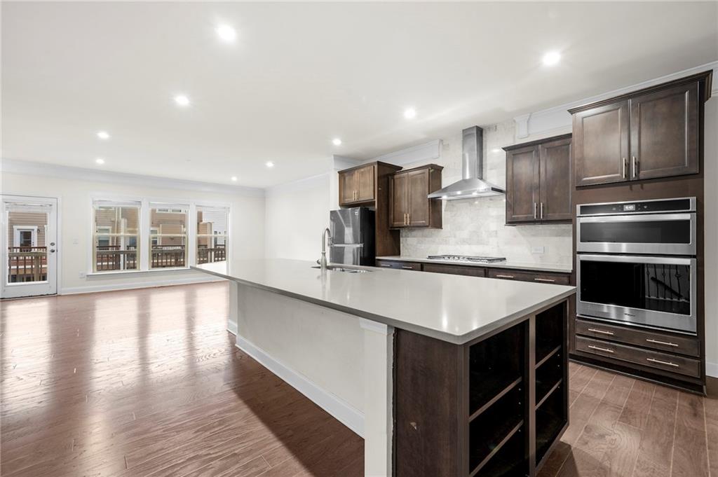 2166 Rock Creek Park Decatur, GA 30033 - Photo 12 of 40 a kitchen with stainless steel appliances granite countertop a sink stove and refrigerator