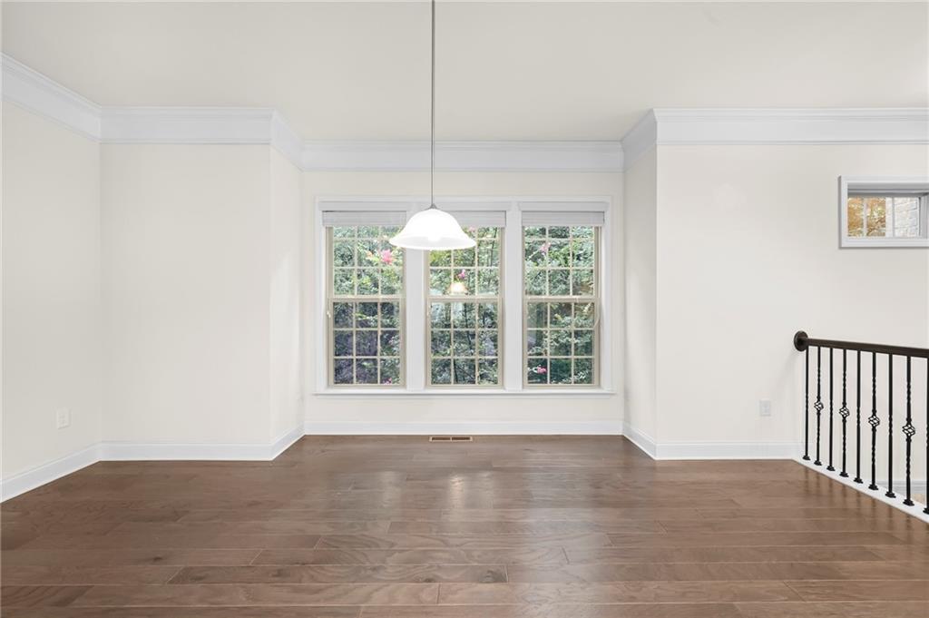 2166 Rock Creek Park Decatur, GA 30033 - Photo 14 of 40 a view of an empty room with wooden floor and a window