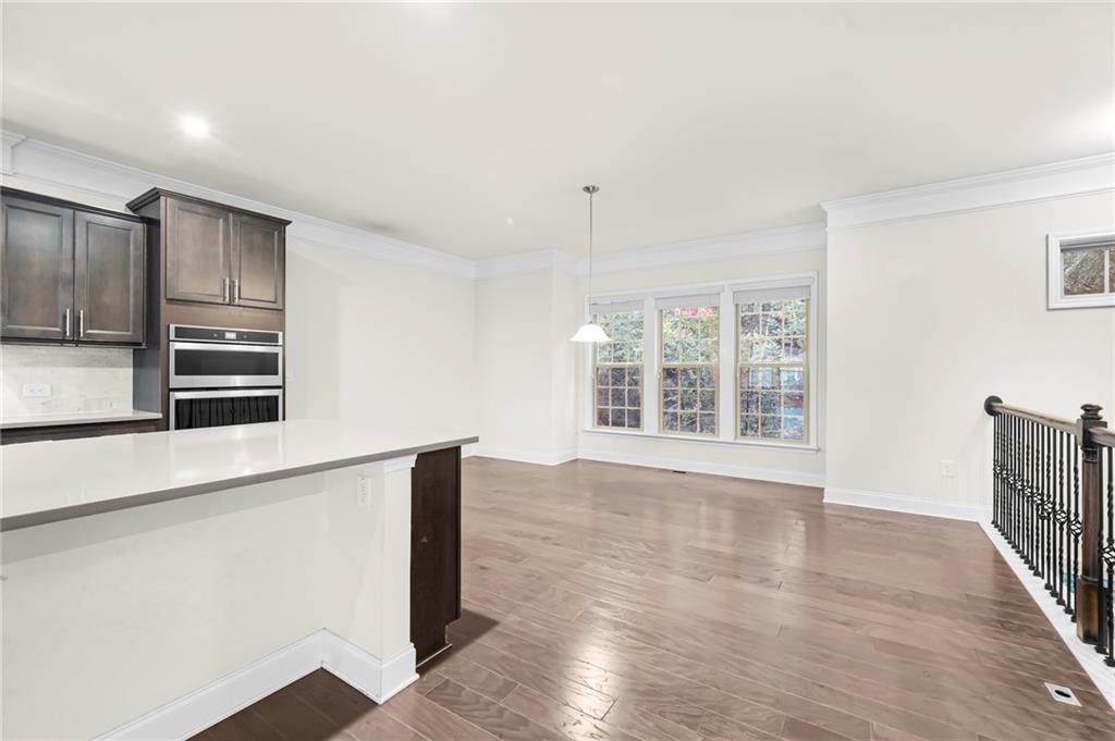 2166 Rock Creek Park Decatur, GA 30033 - Photo 17 of 40 a view of a kitchen with wooden floor and electronic appliances