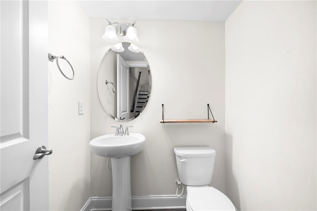 2166 Rock Creek Park Decatur, GA 30033 - Photo 18 of 40 a bathroom with a toilet sink and mirror