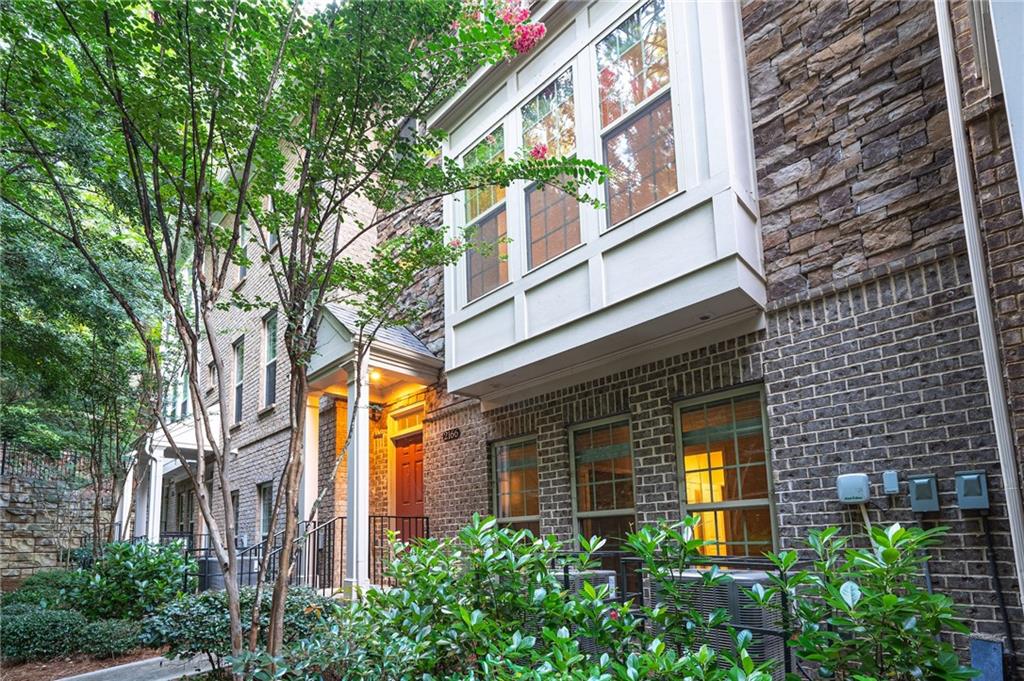2166 Rock Creek Park Decatur, GA 30033 - Photo 2 of 40 a view of a building entryway with plants and brick walls