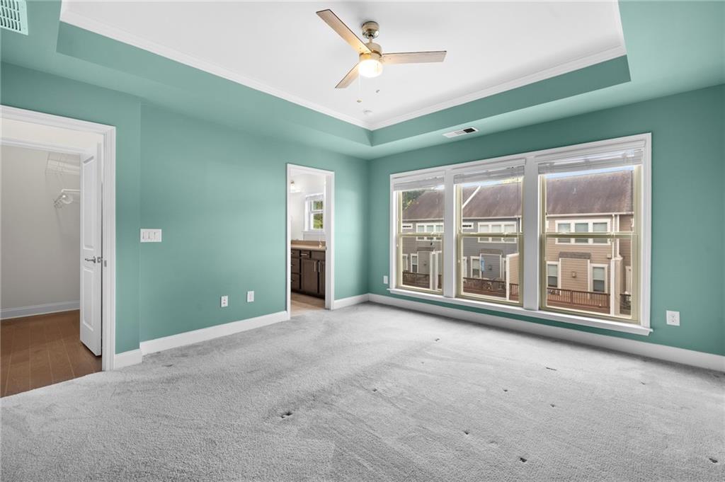 2166 Rock Creek Park Decatur, GA 30033 - Photo 24 of 40 a view of an empty room with a window and a kitchen