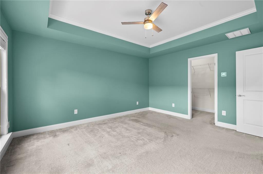 2166 Rock Creek Park Decatur, GA 30033 - Photo 26 of 40 an empty room and chandelier fan