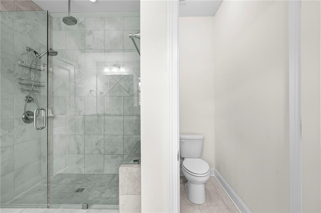 2166 Rock Creek Park Decatur, GA 30033 - Photo 28 of 40 a bathroom with a toilet and a shower