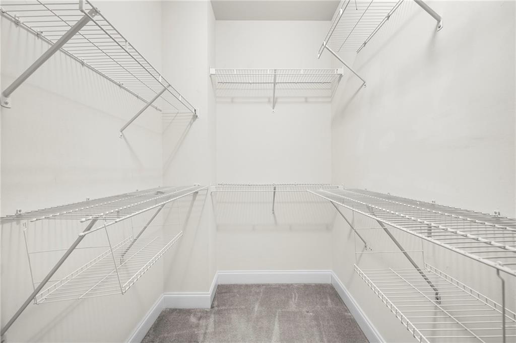 2166 Rock Creek Park Decatur, GA 30033 - Photo 30 of 40 a view of walk in closet with empty racks