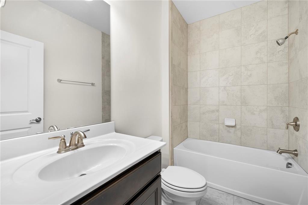 2166 Rock Creek Park Decatur, GA 30033 - Photo 35 of 40 a bathroom with a sink a toilet and bathtub