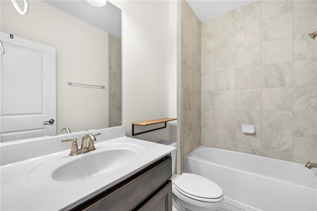 2166 Rock Creek Park Decatur, GA 30033 - Photo 39 of 40 a bathroom with a sink a toilet and a bathtub