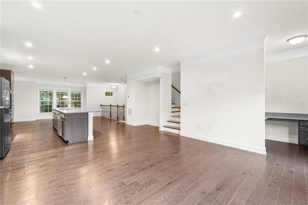 2166 Rock Creek Park Decatur, GA 30033 - Photo 7 of 40 a view of kitchen and hall with wooden floor