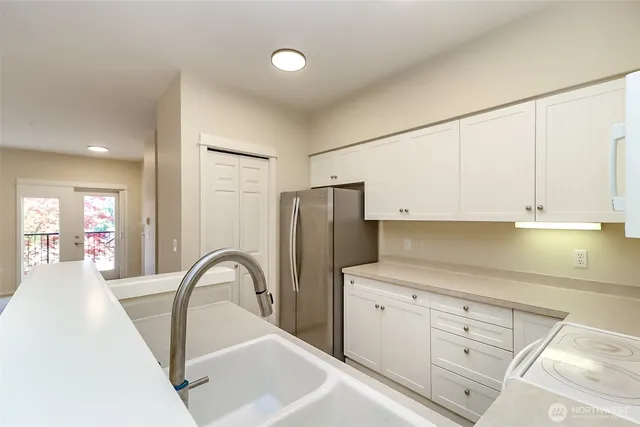 a view of a kitchen with cabinets