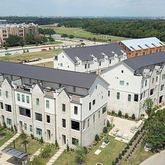 a view of a building with a yard