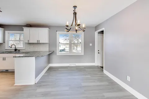 a view of kitchen and center island in center