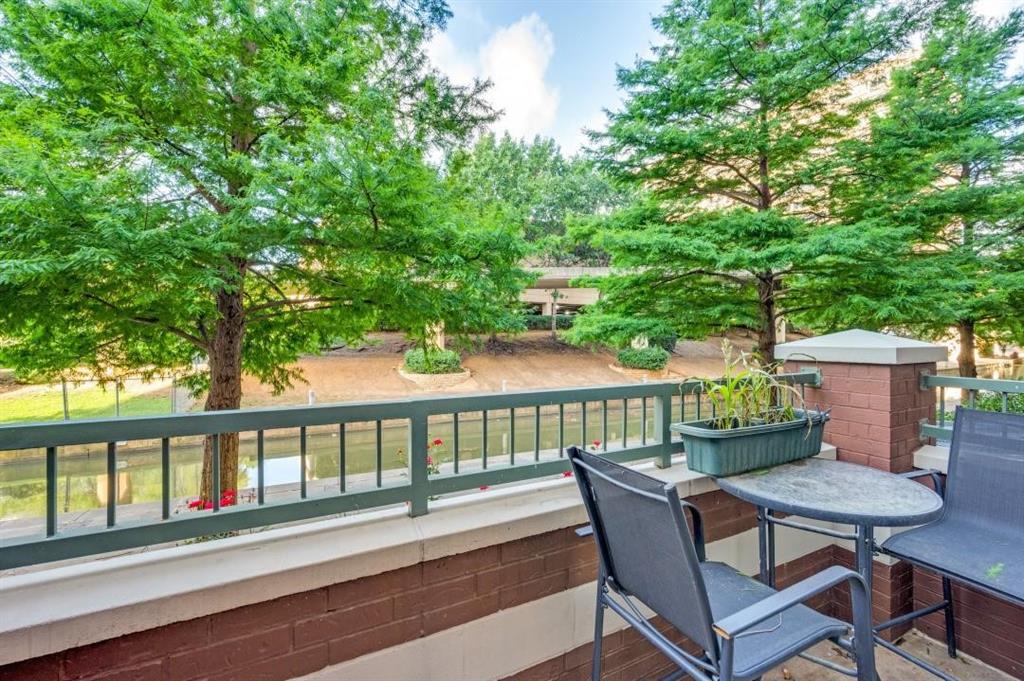 330 Las Colinas Boulevard East, Unit 140 Irving, TX 75039 - Photo 11 of 14 a view of a chair and table on the deck