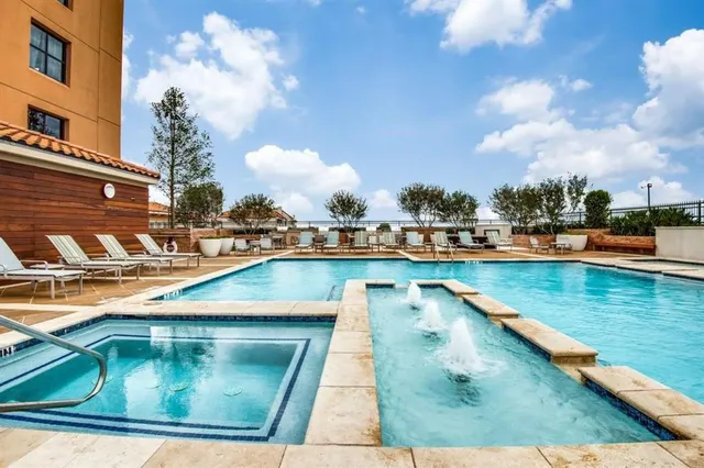 a view of swimming pool with outdoor seating