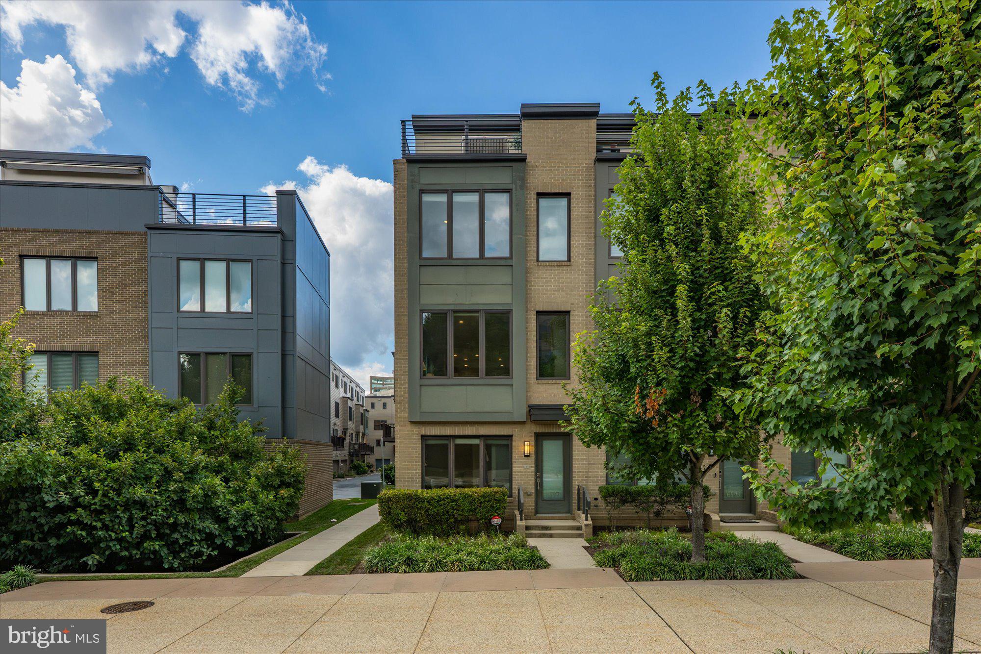 6597 Rock Spring Drive Bethesda, MD 20817 - Photo 1 of 37 front view of house with a yard