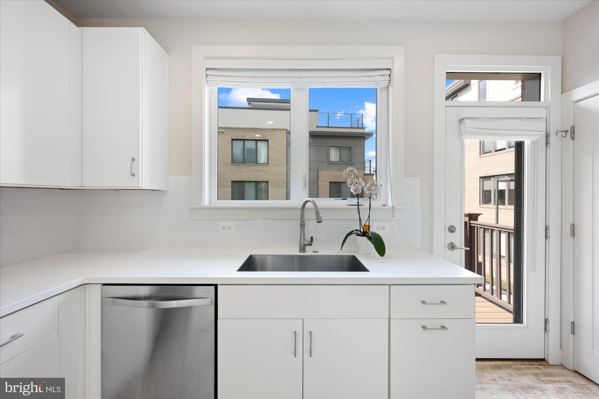 6597 Rock Spring Drive Bethesda, MD 20817 - Photo 11 of 37 a kitchen with a sink and cabinets
