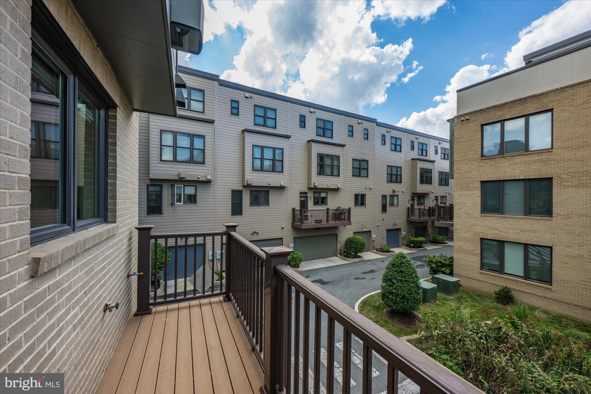 6597 Rock Spring Drive Bethesda, MD 20817 - Photo 14 of 37 a balcony view with a large window and wooden floor