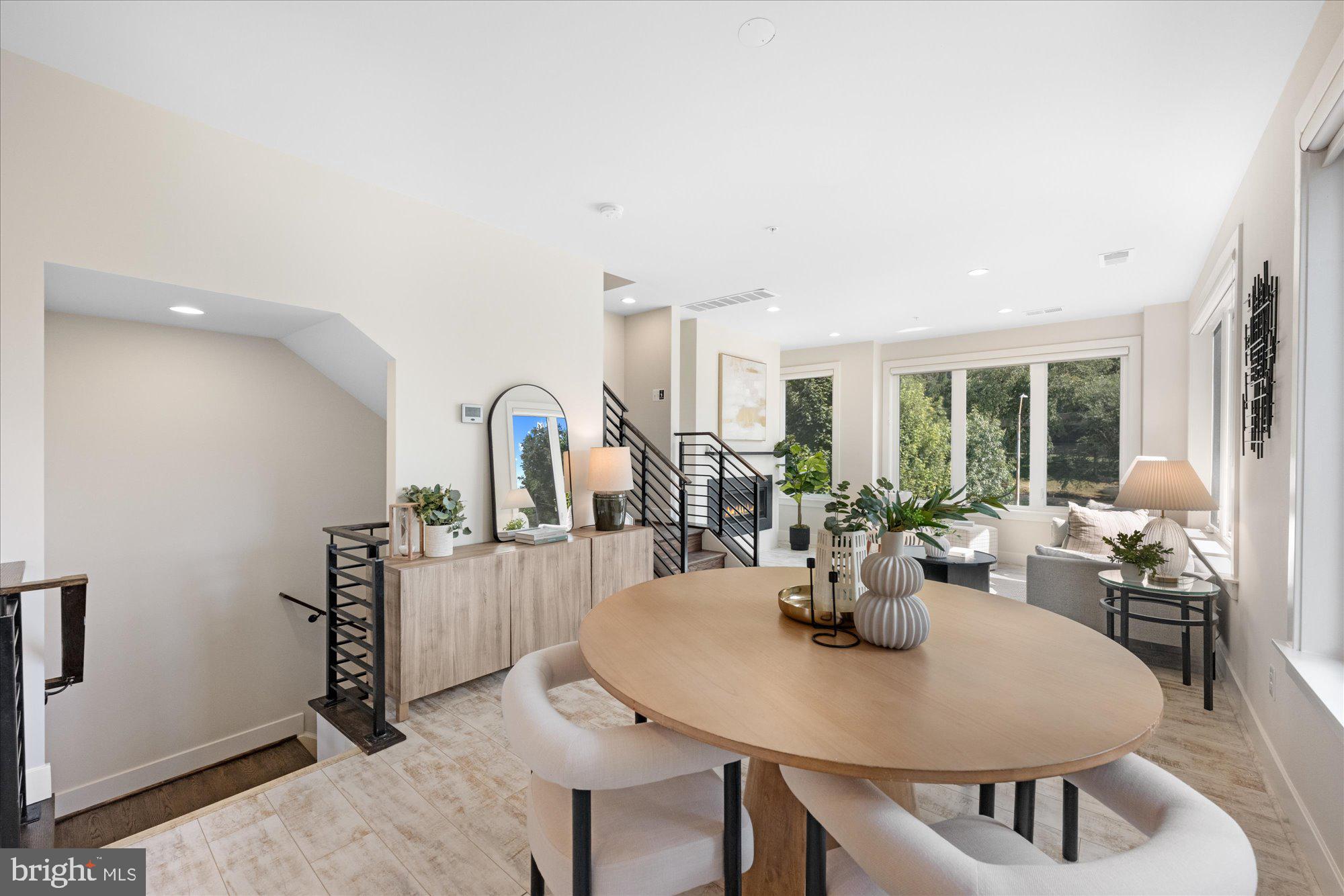 6597 Rock Spring Drive Bethesda, MD 20817 - Photo 18 of 37 a view of a dining room with furniture and window