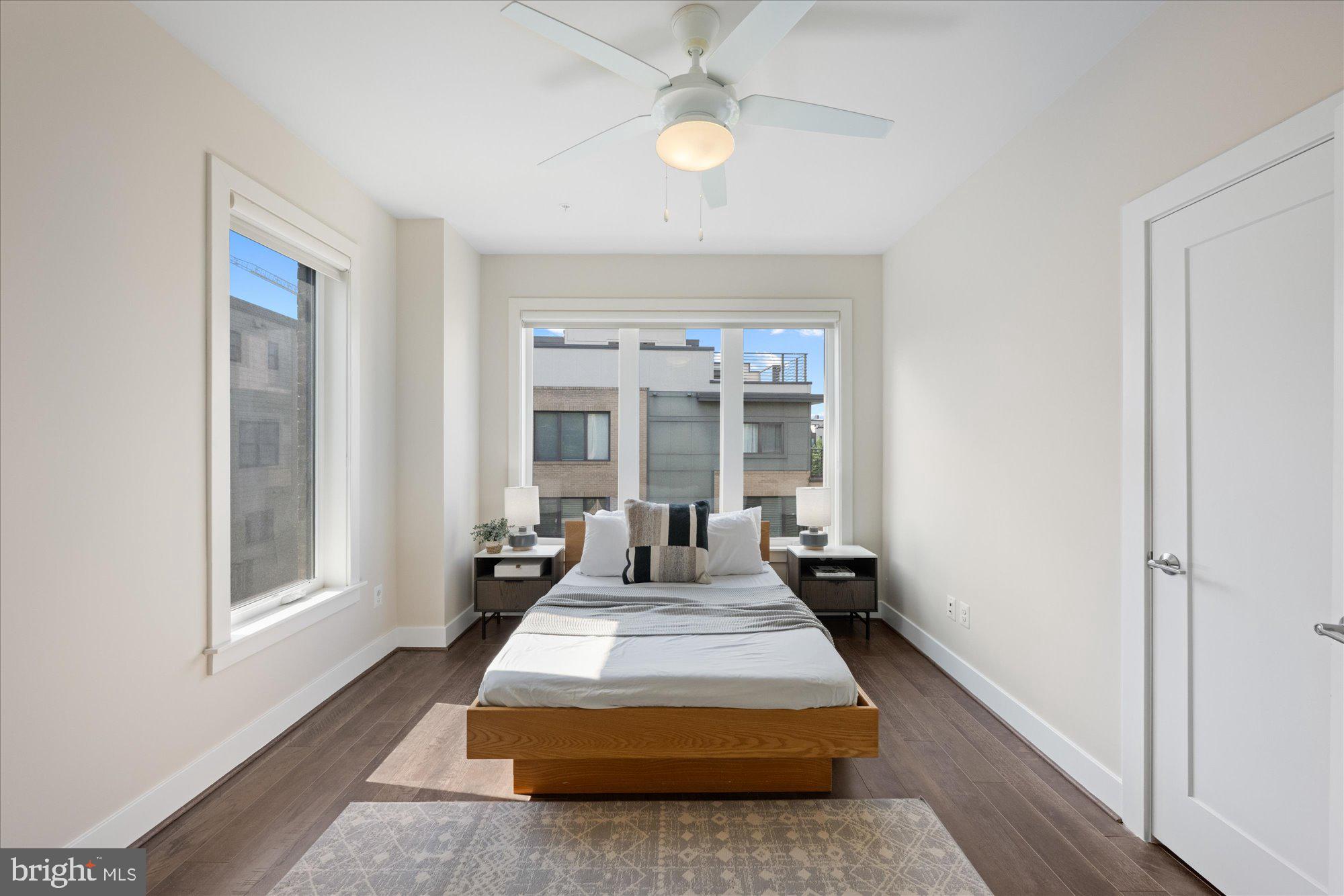 6597 Rock Spring Drive Bethesda, MD 20817 - Photo 23 of 37 a living room with furniture and a chandelier