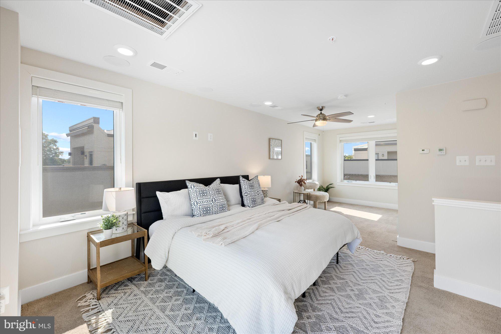 6597 Rock Spring Drive Bethesda, MD 20817 - Photo 30 of 37 a large white bed in a white room