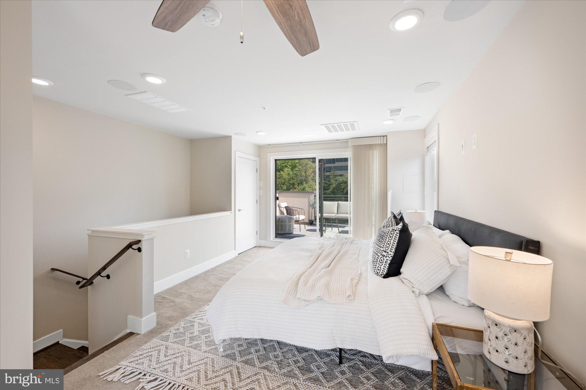 6597 Rock Spring Drive Bethesda, MD 20817 - Photo 31 of 37 a large white bed in a white room