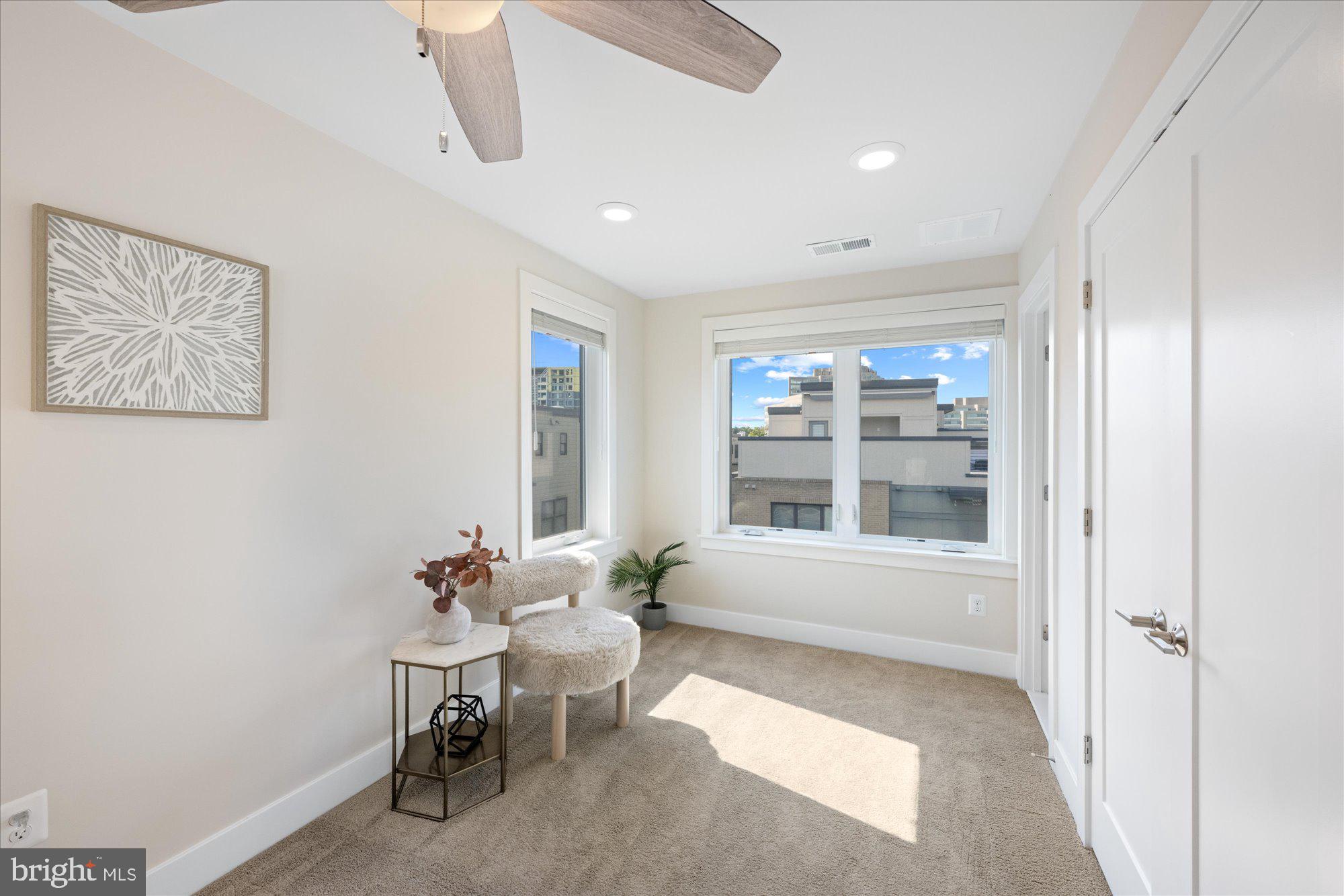 6597 Rock Spring Drive Bethesda, MD 20817 - Photo 32 of 37 a living room with furniture and a window