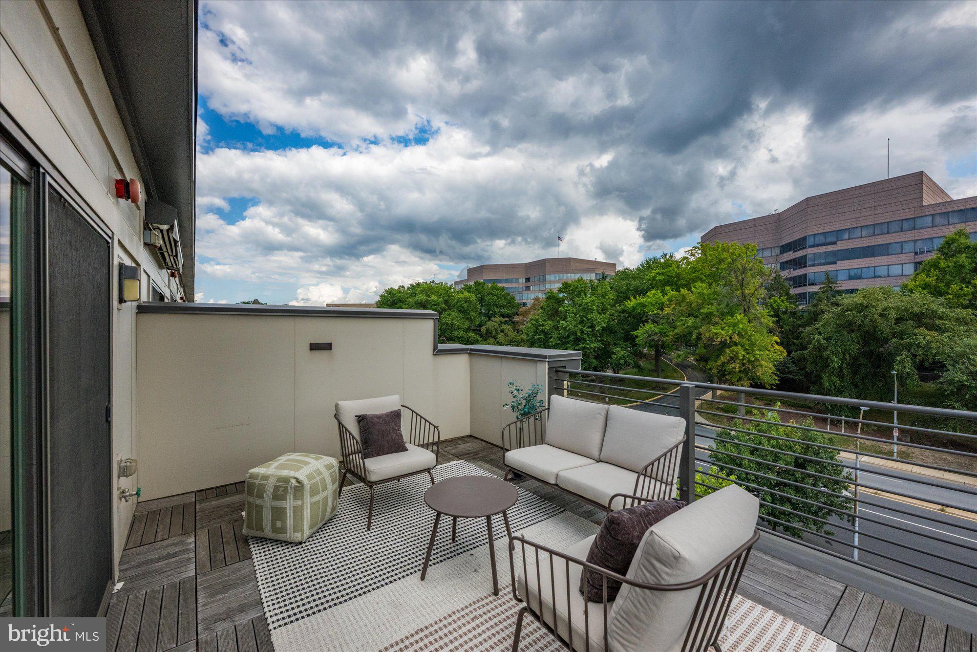 6597 Rock Spring Drive Bethesda, MD 20817 - Photo 35 of 37 a roof deck with couches and potted plants