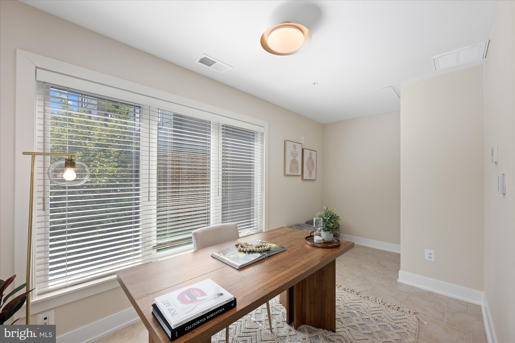 6597 Rock Spring Drive Bethesda, MD 20817 - Photo 5 of 37 a view of a workspace with furniture and a window