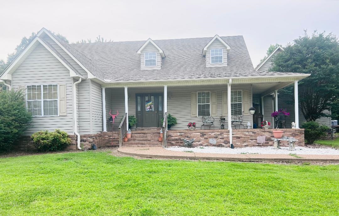 360 Pegg Road Ripley, TN 38063 - Photo 1 of 1 a front view of house with outdoor seating and yard