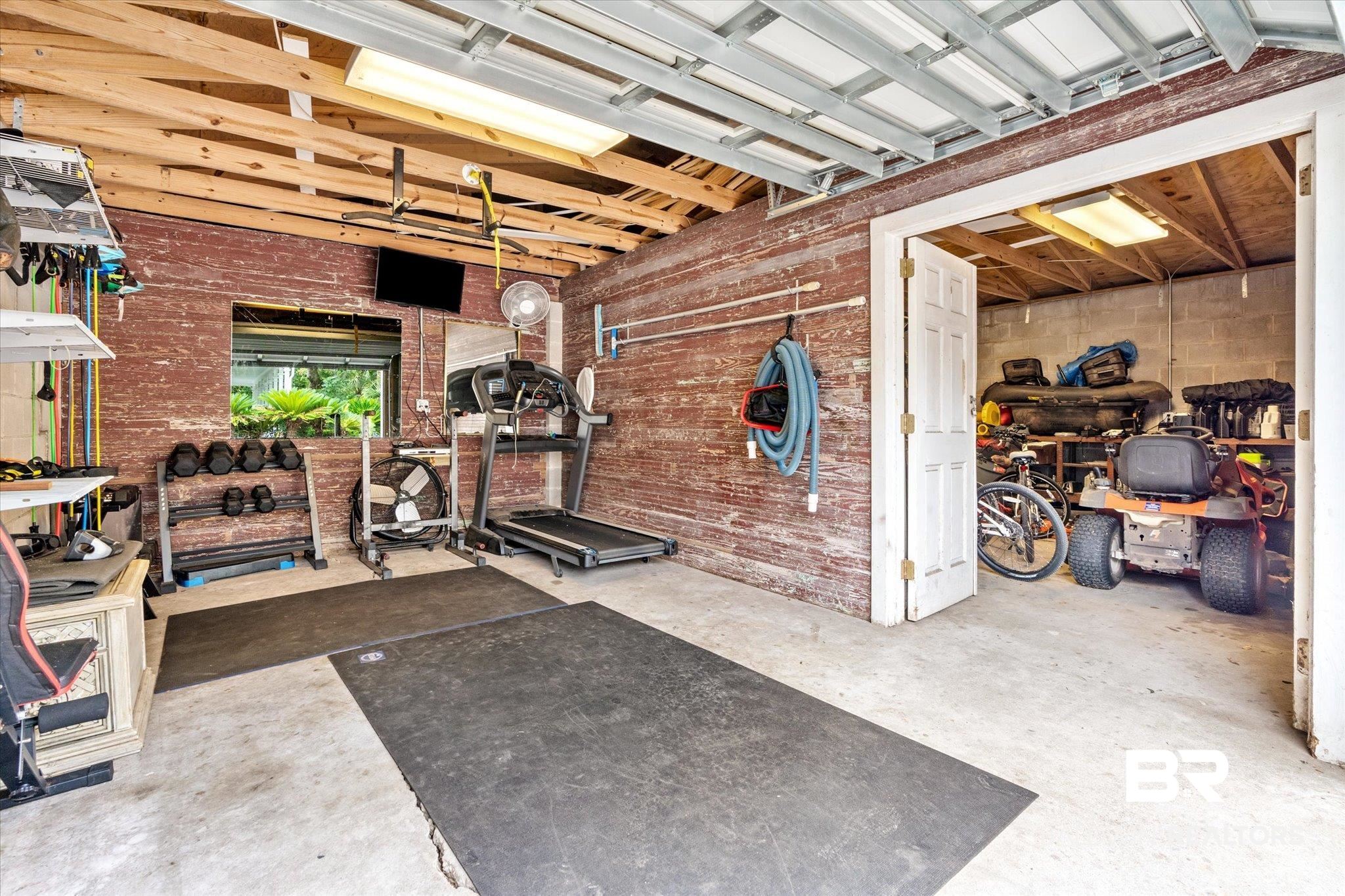 2205 Spring Hill Avenue Mobile, AL 36607 - Photo 43 of 59 Workout room featuring concrete floors and brick wall