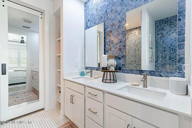 a view of walk in closet with clothes