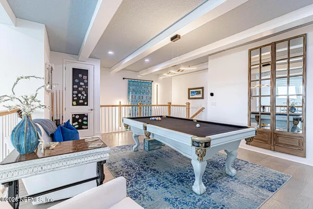 a bedroom with a bed and ceiling fan