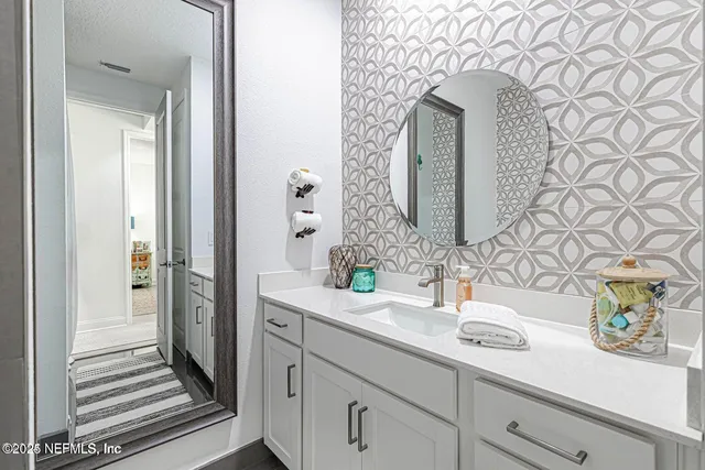 a bathroom with a sink and a shower