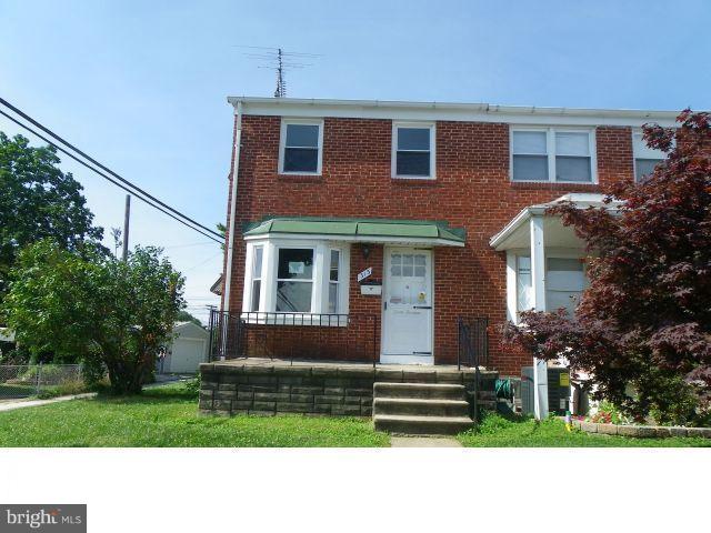 313 Torner Road Essex, MD 21221 - Photo 1 of 5 a front view of a house with a yard
