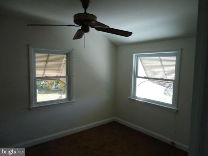 313 Torner Road Essex, MD 21221 - Photo 3 of 5 a view of an empty room with a window