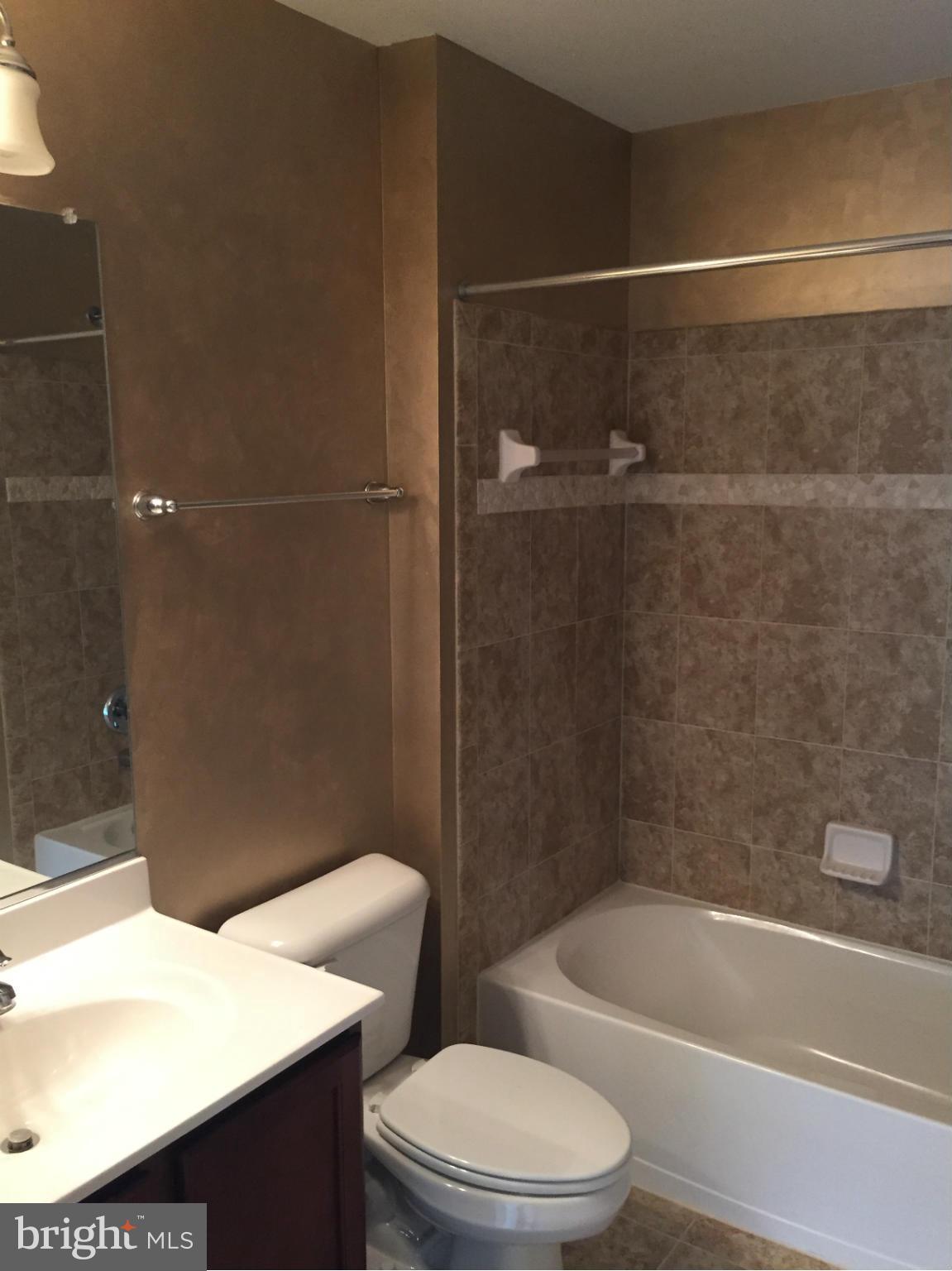 26 Riparian Lane Ranson, WV 25438 - Photo 22 of 28 a bathroom with a sink a toilet and bathtub