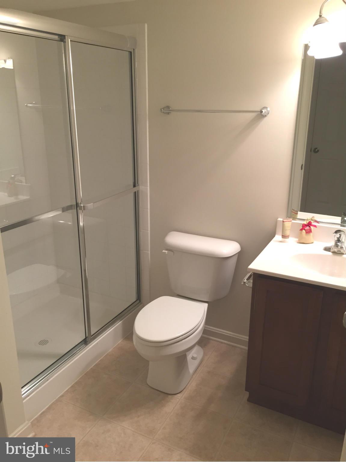 26 Riparian Lane Ranson, WV 25438 - Photo 23 of 28 a bathroom with a sink toilet and shower